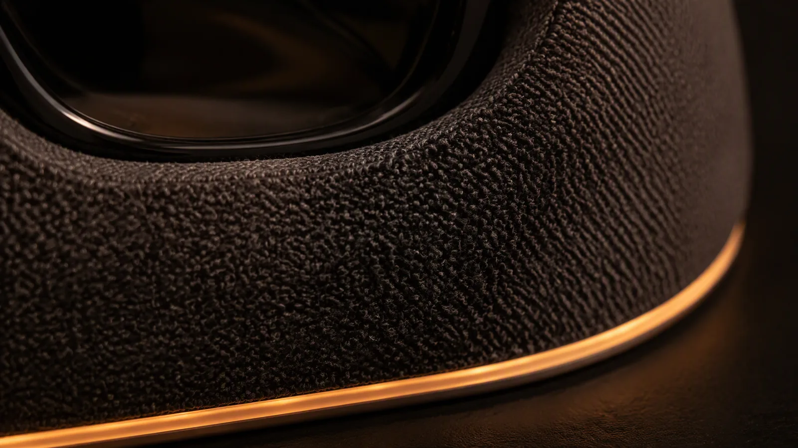 Close-up of wool fabric texture and amber LED line